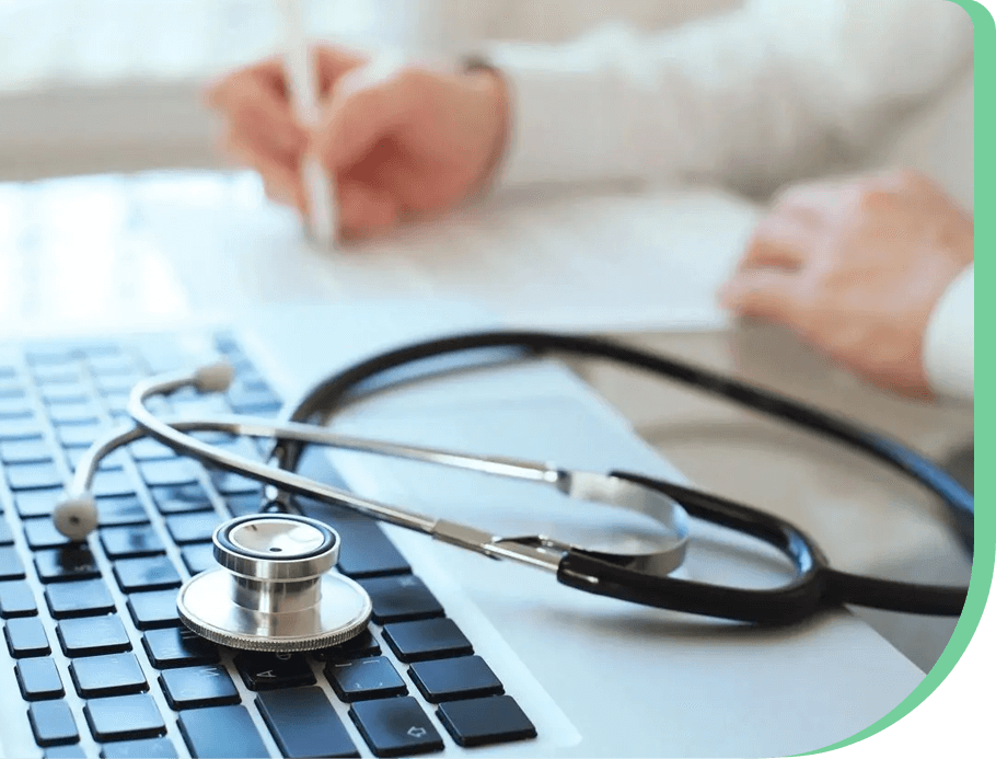 A stethoscope sitting on top of a keyboard.